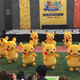 Illustration for article titled Rapidly Deflating Pikachu Rushed To Safety By Small Horde Of Suited Men